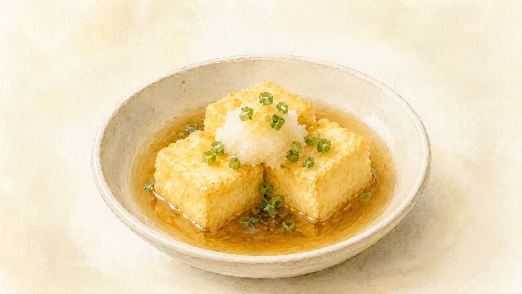 Three golden-brown agedashi tofu cubes in a clear amber dashi broth, green onion and grated daikon garnish on top